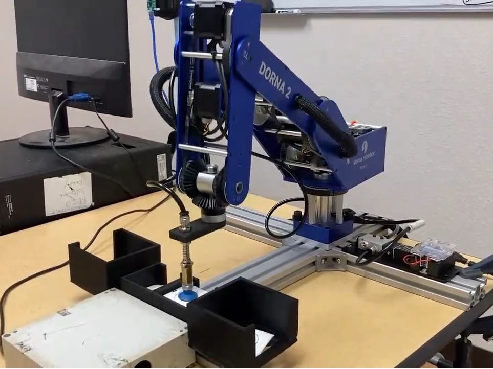 A Dorna 2 Robotic Arm performing pick and place using its Suction Gripper kIt.
