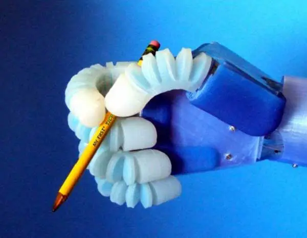 Soft Robotics - Robotic arm functioning as a real human hand - holding a pencil to write.
