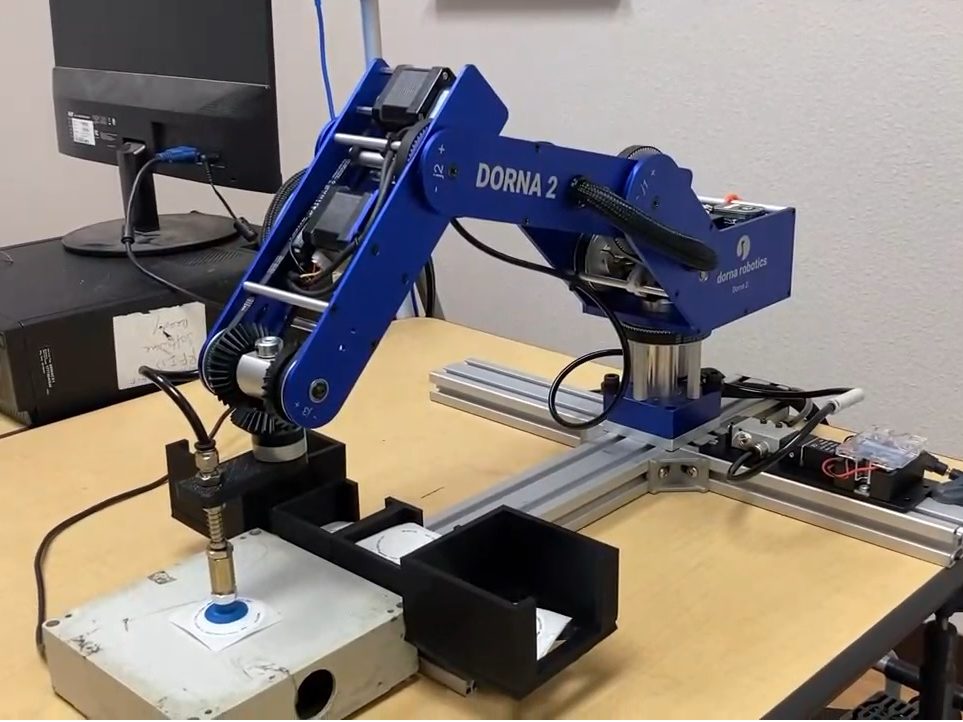Dorna robotic arm performing Quality Control test