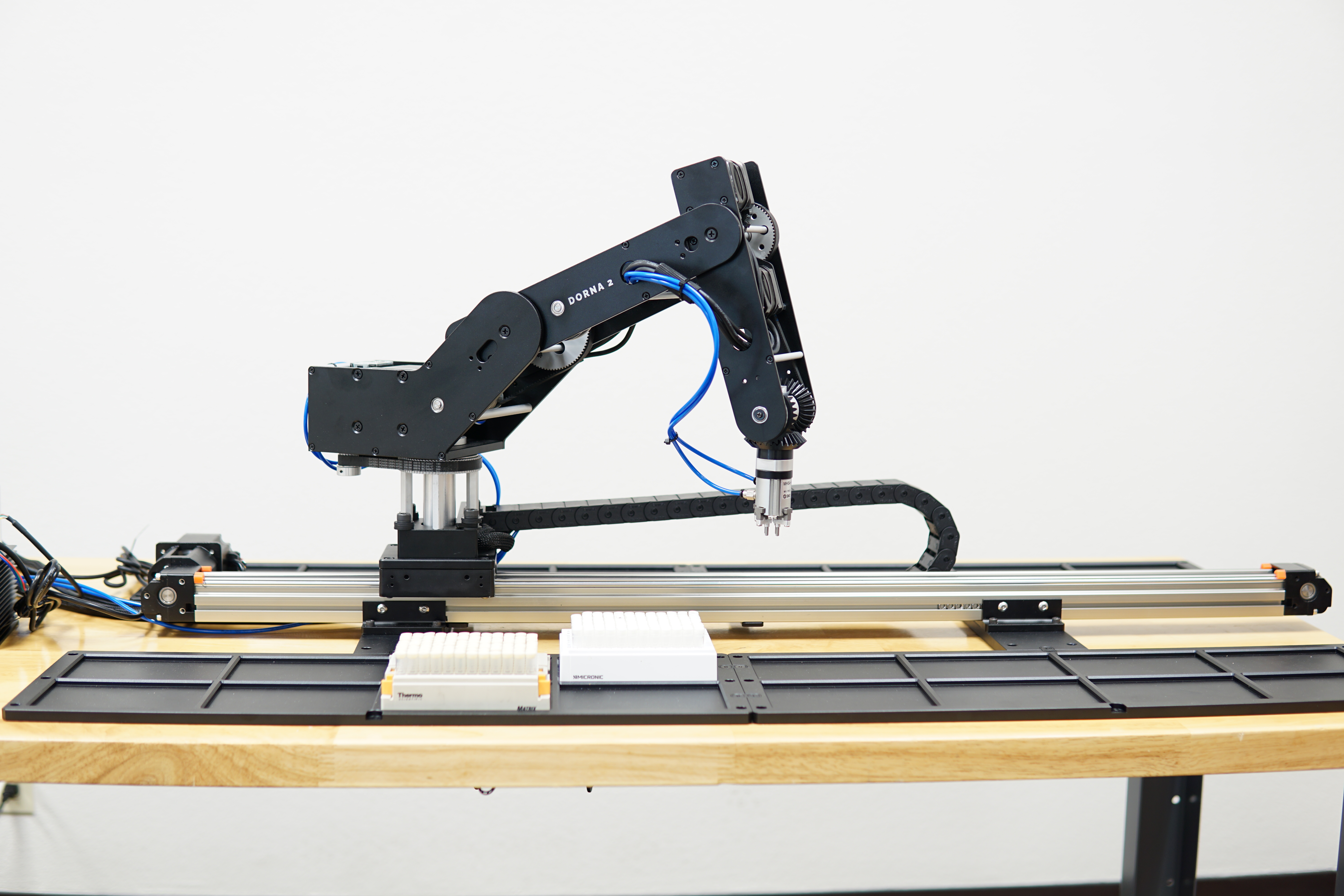 Dorna 2 Robotic Arm rested on an auxiliary axe performing tasks.